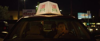 Movie still from “Booksmart” (2019), directed by Olivia Wilde – Two people sitting in the back seat of a car; Close Up shot, Low angle