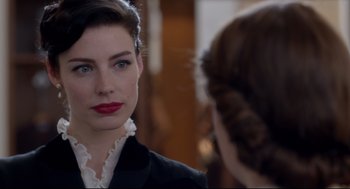Movie still from “Brooklyn” (2015), directed by John Crowley – A woman with red lipstick looking into a mirror; Close Up shot, Over the shoulder angle