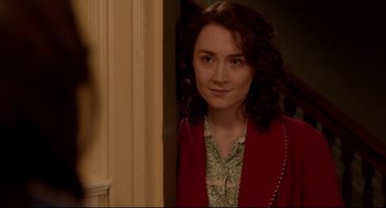Movie still from “Brooklyn” (2015), directed by John Crowley – A young woman standing in front of a door; Close Up shot, Over the shoulder angle
