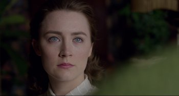 Movie still from “Brooklyn” (2015), directed by John Crowley – A person with blue eyes; Close Up shot, Over the shoulder angle