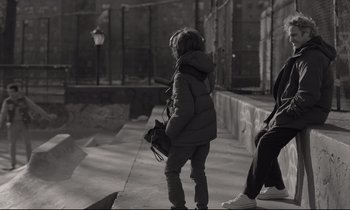 Movie still from “C'mon C'mon” (2021), directed by Mike Mills – A woman in a jacket is standing on a skateboard ramp; Wide shot, Over the shoulder angle