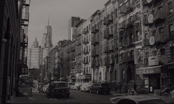 Movie still from “C'mon C'mon” (2021), directed by Mike Mills – A black and white photo of a city street; Extreme Wide shot, Low angle