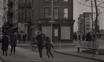 Movie still from “C'mon C'mon” (2021), directed by Mike Mills – A woman and a child walking down a street; Wide shot, High angle