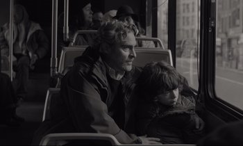Movie still from “C'mon C'mon” (2021), directed by Mike Mills – A man sitting on a bus next to a child; Medium shot, Over the shoulder angle