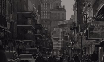 Movie still from “C'mon C'mon” (2021), directed by Mike Mills – Black and white photograph of a busy city street; Extreme Wide shot, Low angle