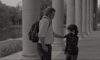 Movie still from “C'mon C'mon” (2021), directed by Mike Mills – An older man and a young boy standing next to each other; Medium shot, Over the shoulder angle