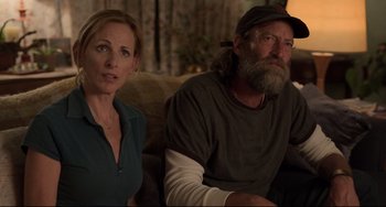 Movie still from “CODA” (2021), directed by Sian Heder – A man and a woman sitting next to each other; Medium shot, Over the shoulder angle