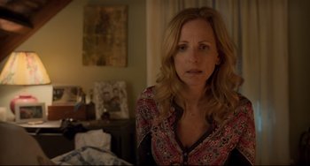 Movie still from “CODA” (2021), directed by Sian Heder – A person sitting in a room near a window; Close Up shot, Over the shoulder angle