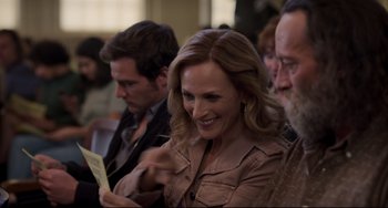 Movie still from “CODA” (2021), directed by Sian Heder – A group of people sitting in a room; Close Up shot, Over the shoulder angle