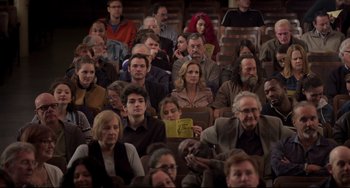 Movie still from “CODA” (2021), directed by Sian Heder – A group of people sitting in a room; Wide shot, High angle