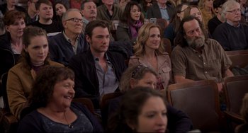 Movie still from “CODA” (2021), directed by Sian Heder – A group of people sitting together in a room; Medium shot, High angle