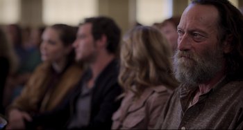 Movie still from “CODA” (2021), directed by Sian Heder – A group of people sitting in front of a window; Close Up shot, Over the shoulder angle
