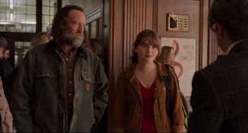 Movie still from “CODA” (2021), directed by Sian Heder – A man and a woman standing next to each other; Medium shot, Over the shoulder angle