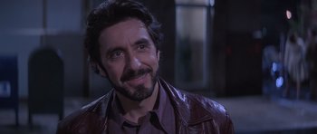 Movie still from “Carlito's Way” (1993), directed by Brian De Palma – A person wearing a leather jacket; Close Up shot, Over the shoulder angle