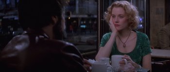 Movie still from “Carlito's Way” (1993), directed by Brian De Palma – A man and a woman sitting at a table in front of each other; Close Up shot, Over the shoulder angle