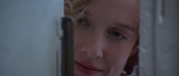 Movie still from “Carlito's Way” (1993), directed by Brian De Palma – A young woman's face; Extreme Close Up shot, Over the shoulder angle