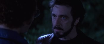 Movie still from “Carlito's Way” (1993), directed by Brian De Palma – A person with a beard; Close Up shot, Over the shoulder angle