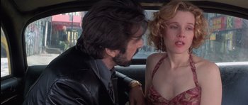 Movie still from “Carlito's Way” (1993), directed by Brian De Palma – A man and a woman sitting in the back of a car; Close Up shot, Over the shoulder angle