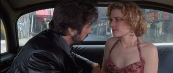 Movie still from “Carlito's Way” (1993), directed by Brian De Palma – A man and a woman sitting in the back of a car; Close Up shot, Over the shoulder angle