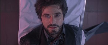 Movie still from “Carlito's Way” (1993), directed by Brian De Palma – A person wearing a suit and tie; Close Up shot, Overhead angle