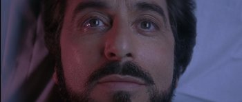 Movie still from “Carlito's Way” (1993), directed by Brian De Palma – A man's eyes and beard; Extreme Close Up shot, Low angle