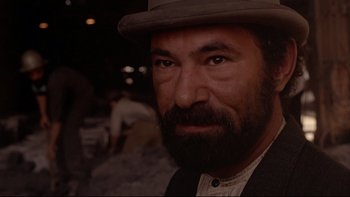 Movie still from “Days of Heaven” (1978), directed by Terrence Malick – A person wearing a hat; Close Up shot, Over the shoulder angle