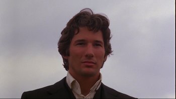 Movie still from “Days of Heaven” (1978), directed by Terrence Malick – A person wearing a suit and tie; Close Up shot, Low angle