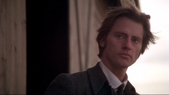 Movie still from “Days of Heaven” (1978), directed by Terrence Malick – A person wearing a suit and tie; Close Up shot, Low angle