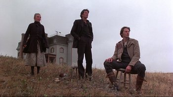 Movie still from “Days of Heaven” (1978), directed by Terrence Malick – A group of people standing in a grassy field; Wide shot, Low angle
