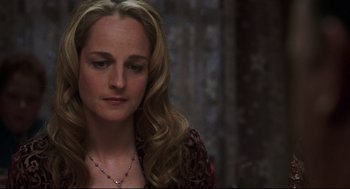 Movie still from “Cast Away” (2000), directed by Robert Zemeckis – A woman with long blonde hair wearing a necklace; Close Up shot, High angle