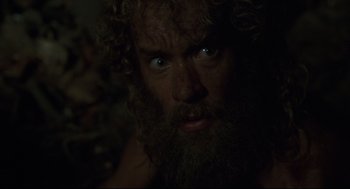 Movie still from “Cast Away” (2000), directed by Robert Zemeckis – A man with a long beard and a beard on his face; Close Up shot, Low angle