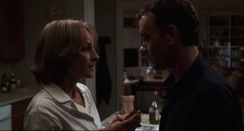 Movie still from “Cast Away” (2000), directed by Robert Zemeckis – A man and a woman looking at a cell phone; Close Up shot, Over the shoulder angle