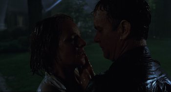 Movie still from “Cast Away” (2000), directed by Robert Zemeckis – A man and a woman in the rain touching each other; Close Up shot, Low angle