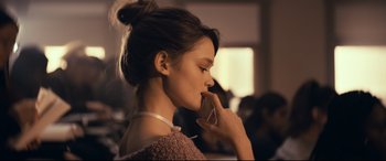 Movie still from “Cherry” (2021), directed by Joe Russo – A woman with her hand on her face; Close Up shot, Over the shoulder angle