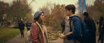 Movie still from “Cherry” (2021), directed by Joe Russo – A man and a woman are standing in a park; Medium shot, Over the shoulder angle