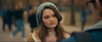 Movie still from “Cherry” (2021), directed by Joe Russo – A woman with a blue hat is posing for a picture; Close Up shot, Over the shoulder angle