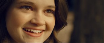 Movie still from “Cherry” (2021), directed by Joe Russo – A woman's face with brown eyes; Extreme Close Up shot, Over the shoulder angle