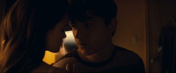 Movie still from “Cherry” (2021), directed by Joe Russo – A man and a woman looking into each others eyes; Close Up shot, Over the shoulder angle