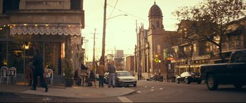 Movie still from “Cherry” (2021), directed by Joe Russo – Two people standing on the side of the street; Extreme Wide shot, Over the shoulder angle