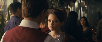 Movie still from “Cherry” (2021), directed by Joe Russo – A young woman is looking at a man; Close Up shot, Over the shoulder angle