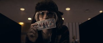 Movie still from “Cherry” (2021), directed by Joe Russo – A woman holding a fake gun in front of her face; Close Up shot, Low angle