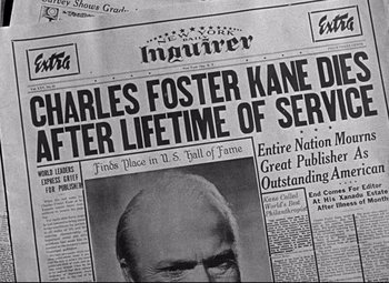 Movie still from “Citizen Kane” (1941), directed by Orson Welles – An old newspaper with a picture of charles foster kane on it; Extreme Close Up shot, High angle