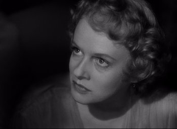 Movie still from “Citizen Kane” (1941), directed by Orson Welles – An old photo of an older woman looking at the camera; Close Up shot, Low angle