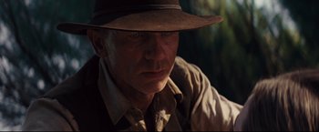 Movie still from “Cowboys & Aliens” (2011), directed by Jon Favreau – A person wearing a hat; Close Up shot, Over the shoulder angle