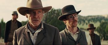 Movie still from “Cowboys & Aliens” (2011), directed by Jon Favreau – A man and a man wearing a hat and a suit; Close Up shot, Over the shoulder angle