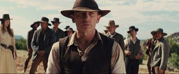 Movie still from “Cowboys & Aliens” (2011), directed by Jon Favreau – A man wearing a hat and a vest; Close Up shot, Over the shoulder angle