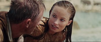 Movie still from “Cowboys & Aliens” (2011), directed by Jon Favreau – A young woman is looking at a young man's reflection in a mirror; Close Up shot, Over the shoulder angle