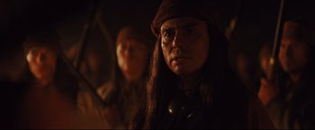 Movie still from “Cowboys & Aliens” (2011), directed by Jon Favreau – An old man with long hair and a hat; Close Up shot, Over the shoulder angle