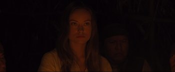 Movie still from “Cowboys & Aliens” (2011), directed by Jon Favreau – A young woman is looking at the camera while standing next to an older man; Close Up shot, Over the shoulder angle