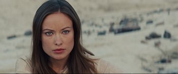 Movie still from “Cowboys & Aliens” (2011), directed by Jon Favreau – A person with long brown hair; Close Up shot, Over the shoulder angle